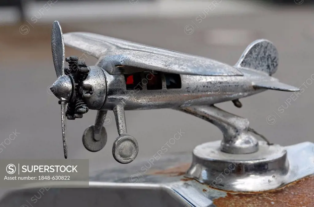 Small plane with a propeller and an air-cooled radial engine, hood ornament of a U.S. vintage car, Franklin Airman from 1927, Meilenwerk Duesseldorf, ...