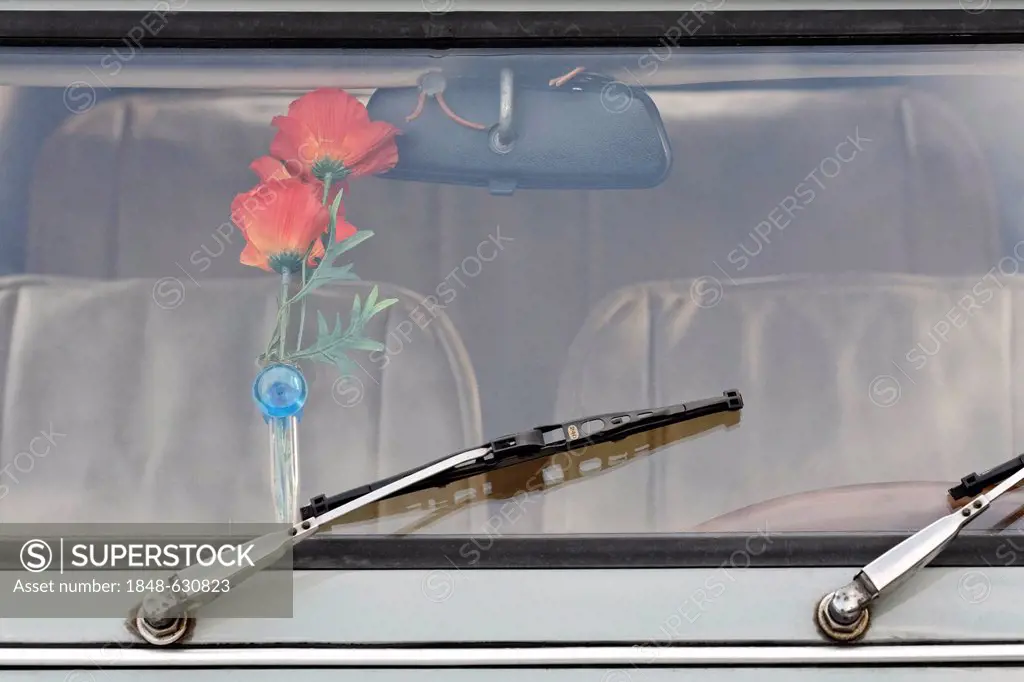 Kitschy vase of plastic flowers behind the windshield of an old Citroen 2CV, Germany, Europe