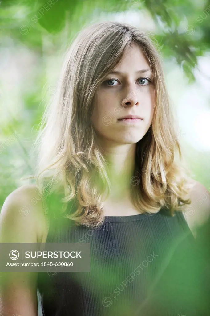 Young woman, portrait, in natural surroundings