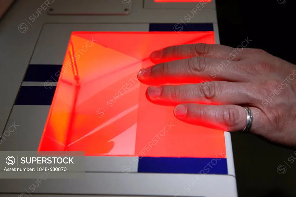 A suspect's fingerprints are taken at the police, scanning of fingerprints and palm prints, criminal investigation department of the police, Germany, ...