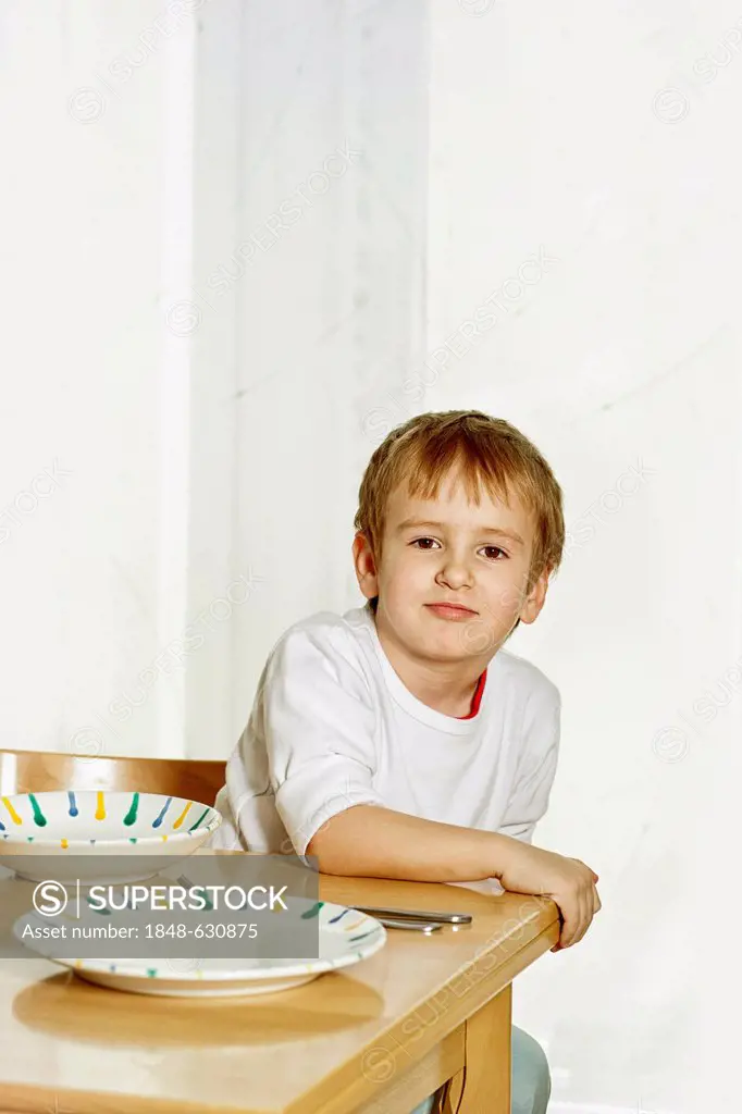 Boy sitting at the dinner table