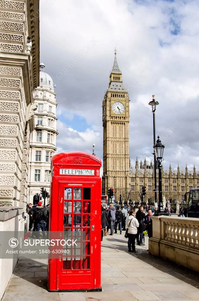 Red telephone booth in front of the clock or bell tower, Big Ben, of the Houses or Parliament, London, South England, England, United Kingdom, Europe