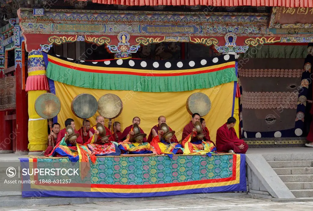 Tibetan Buddhism, monk orchestra accompanying religious masked Cham dance, in the important Kumbum Monastery, Gelug or Gelug-pa yellow hat sect, , Ta'...