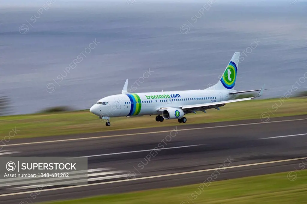 Landing approach of passenger plane of Transavia Airlines at the airport of Madeira, LPMA, Funchal Airport or Airport Santa Catarina, Madeira, Portuga...