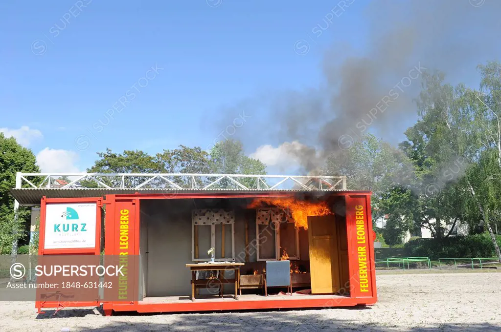 Demonstration of a room fire in a fire-container at the Feuerwehr Leonberg fire brigade, Baden-Wuerttemberg, Germany, Europe