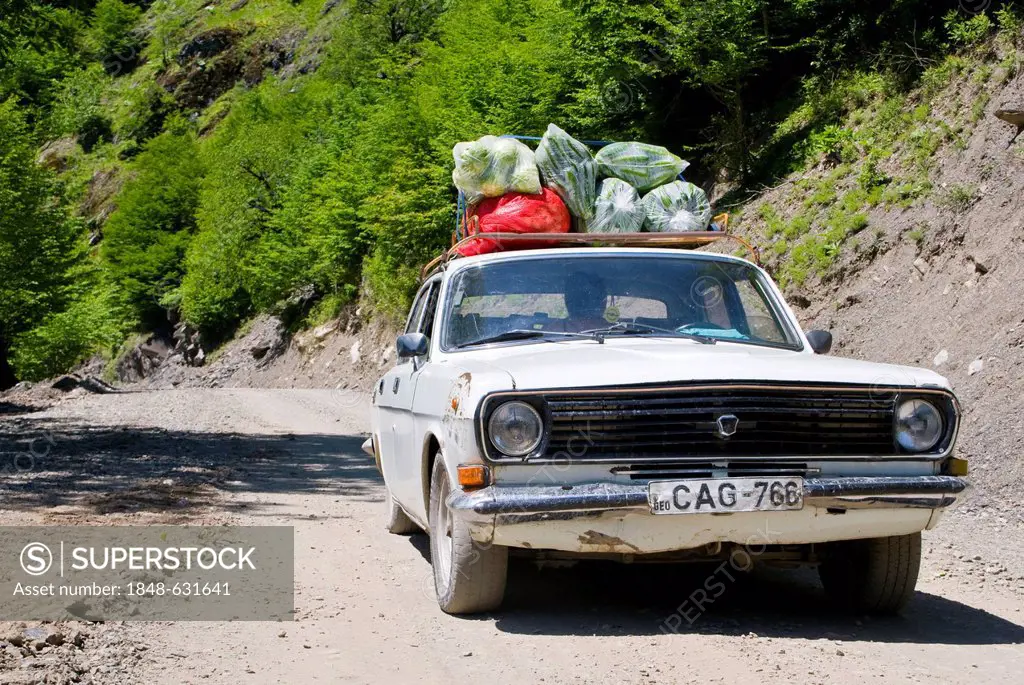 Overloaded car on its way to the Svaneti province, Georgia, Caucasus region, Middle East
