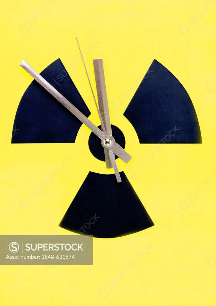 Atomic symbol with clock hands set at 11:55, symbolic image for to phase-out nuclear power