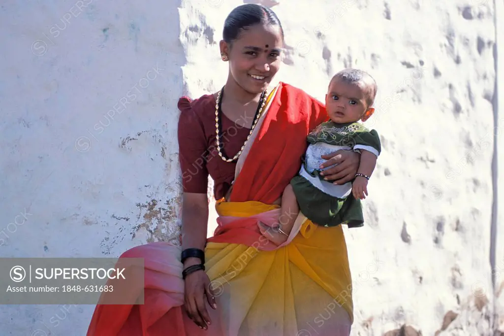 Woman holding a child, Badami, Karnataka, South India, India, Asia