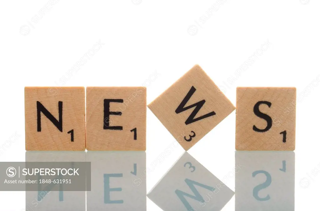 Letter tiles forming the word News