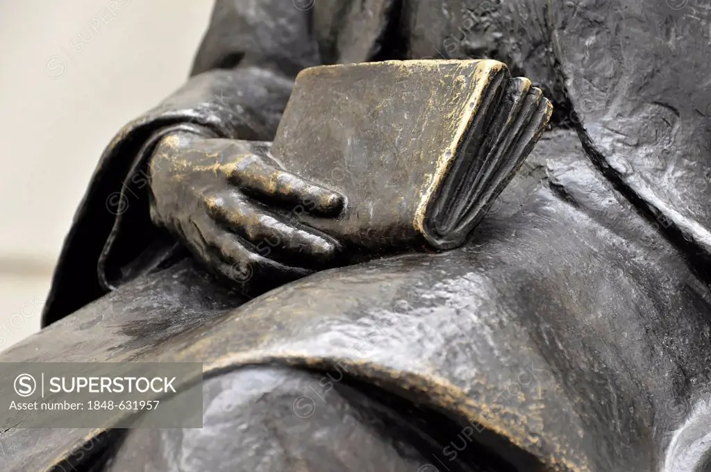 Detailed view of the book and the hand, bronze statue of Adam Riese, Cordoba, Andalusia, Spain, Europe