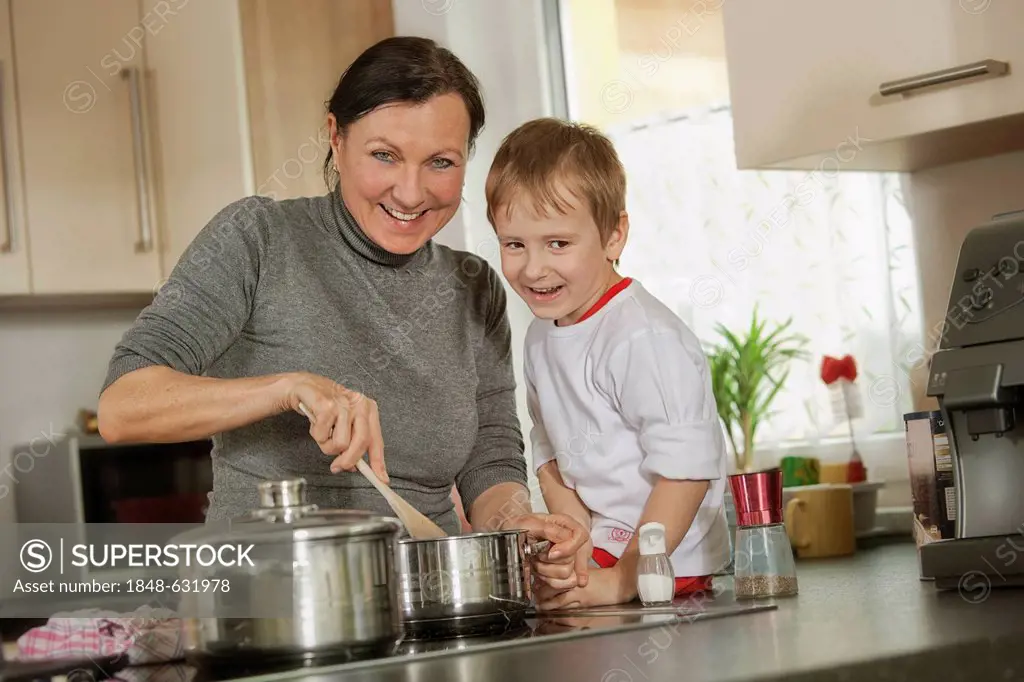 Mother and son cooking in the kitchen
