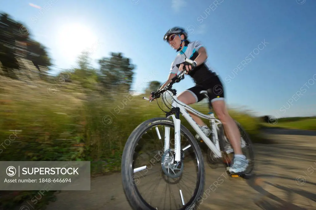 Female cyclist riding a mountain bike, bicycle, Stuttgart, Baden-Wuerttemberg, Germany, Europe, PublicGround