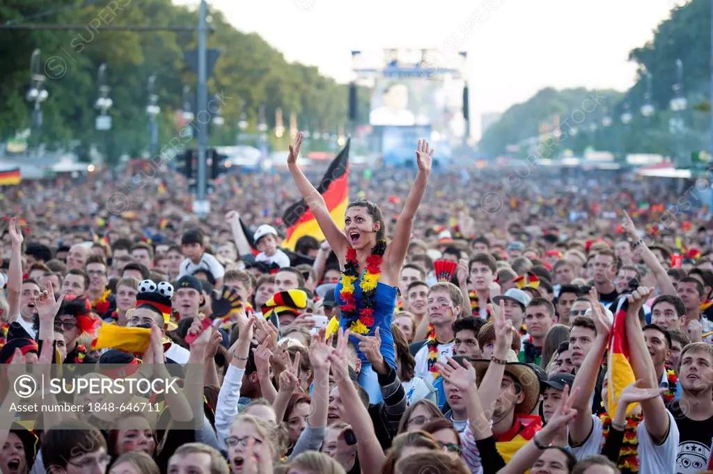 Football fans watching the first match of the German national team during the Euro 2012 championships at Fanpark Berlin, Strasse des 17. Juni street, ...