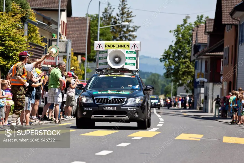 Support and security vehicle with the inscription Caution, bicycle race at the final stage of the Tour de Suisse 2012 Naefels to Soerenberg, Switzerla...