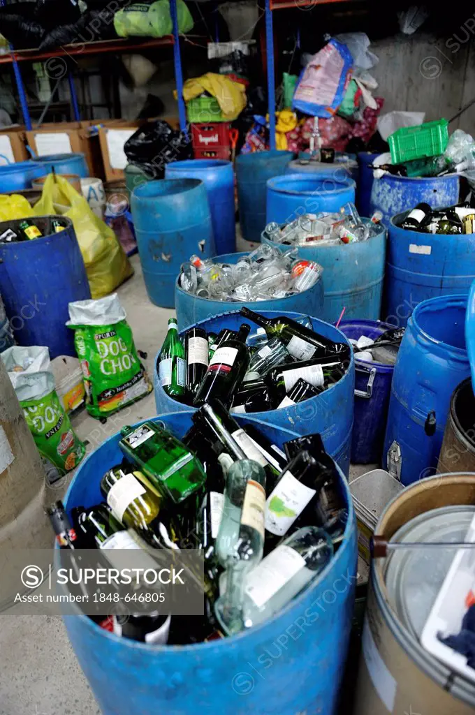 Separated recyclable materials, waste glass, medium-sized company of a women's organisation separating rubbish and selling the resources to the indust...