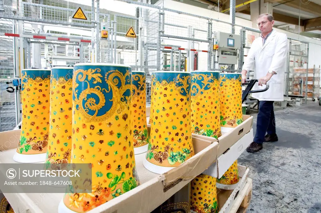 Employee transporting unfired Versace vases to the kiln of the porcelain manufacturer Rosenthal GmbH, Speichersdorf, Bavaria, Germany, Europe