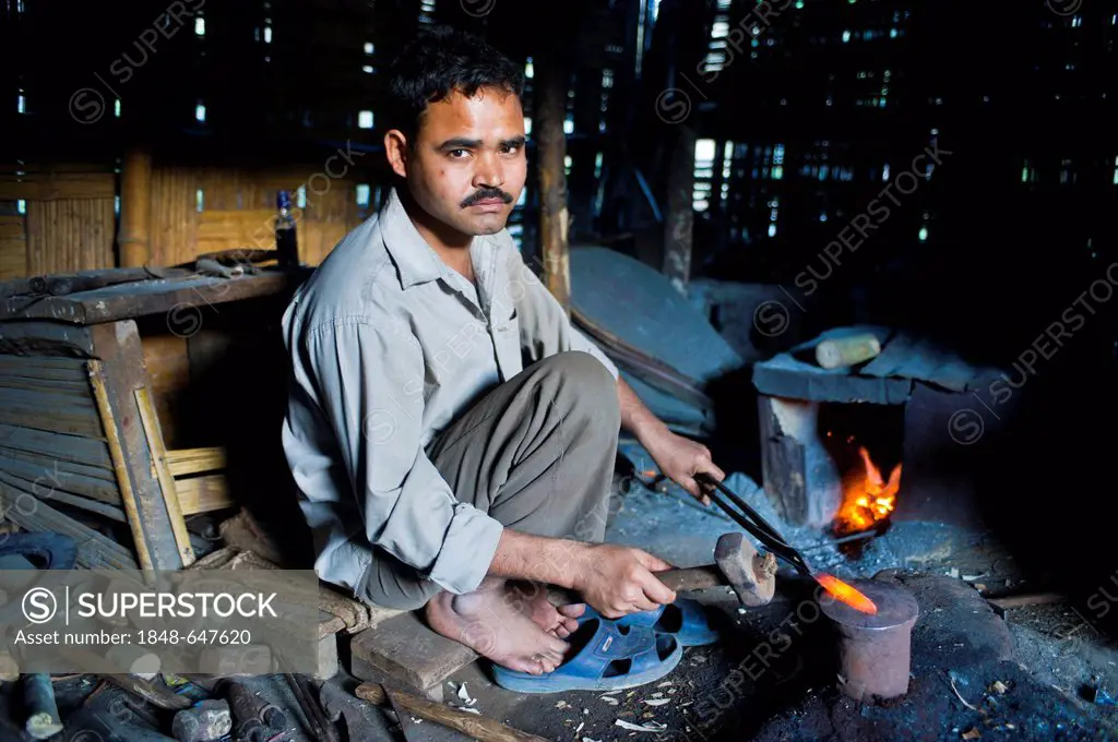 Blacksmith forging a machete, Arunachal Pradesh, North East India, India, Asia