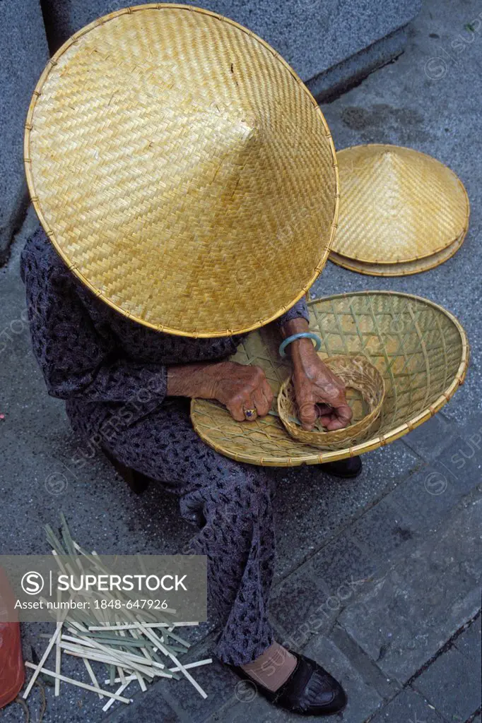 Woman weaving a hat, Hong Kong, China, Asia