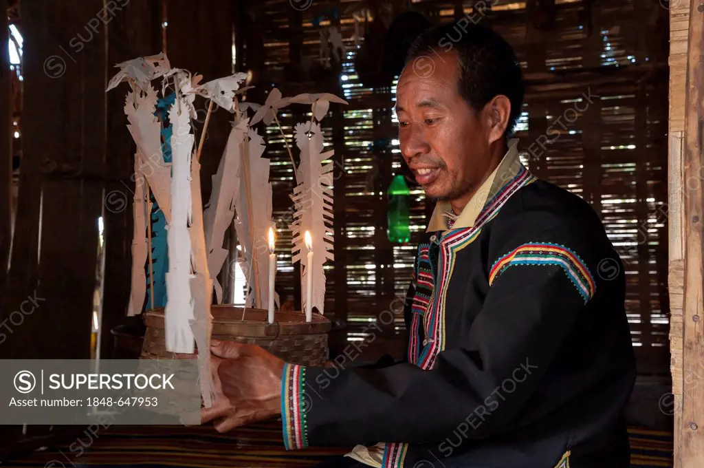 Traditionally dressed man from the Black Hmong hill tribe, ethnic minority from East Asia, during a traditional ceremony, Northern Thailand, Thailand,...