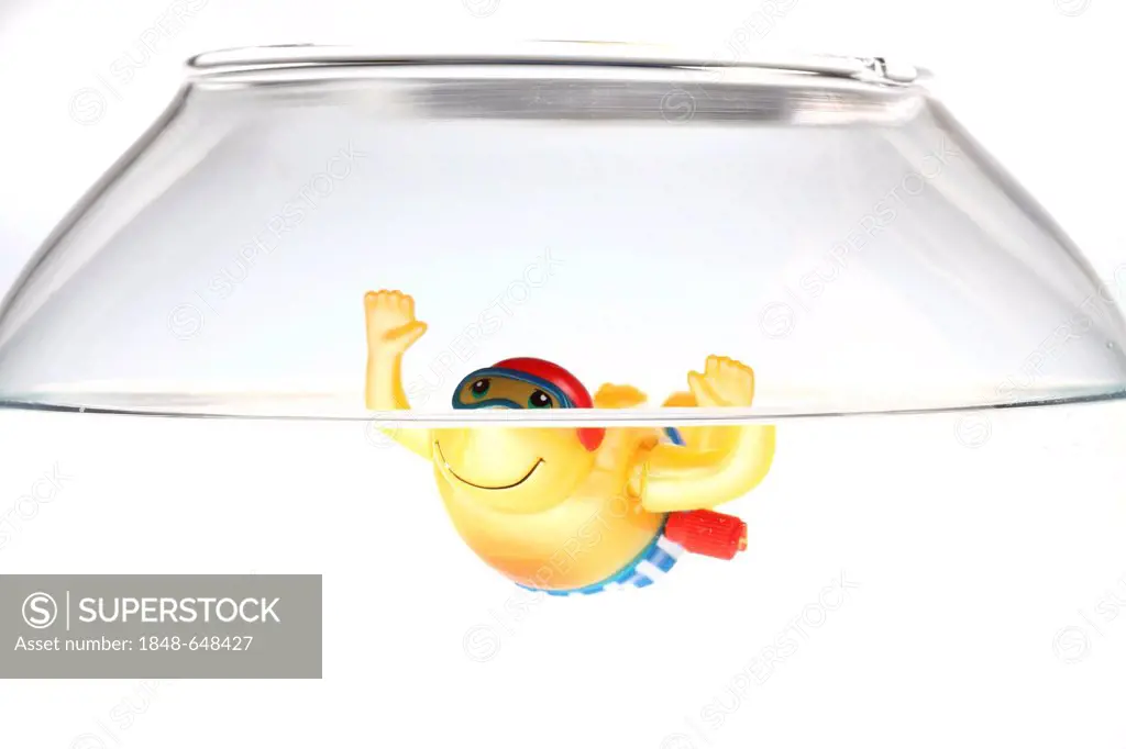 Wind-up toy figure of a boy swimming in a fish bowl, illustration