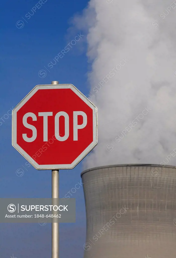 Symbolic image against nuclear power, stop sign in front of a cooling tower of Gundremmingen Nuclear Power Plant, Gundremmingen near Guenzburg, Bavari...