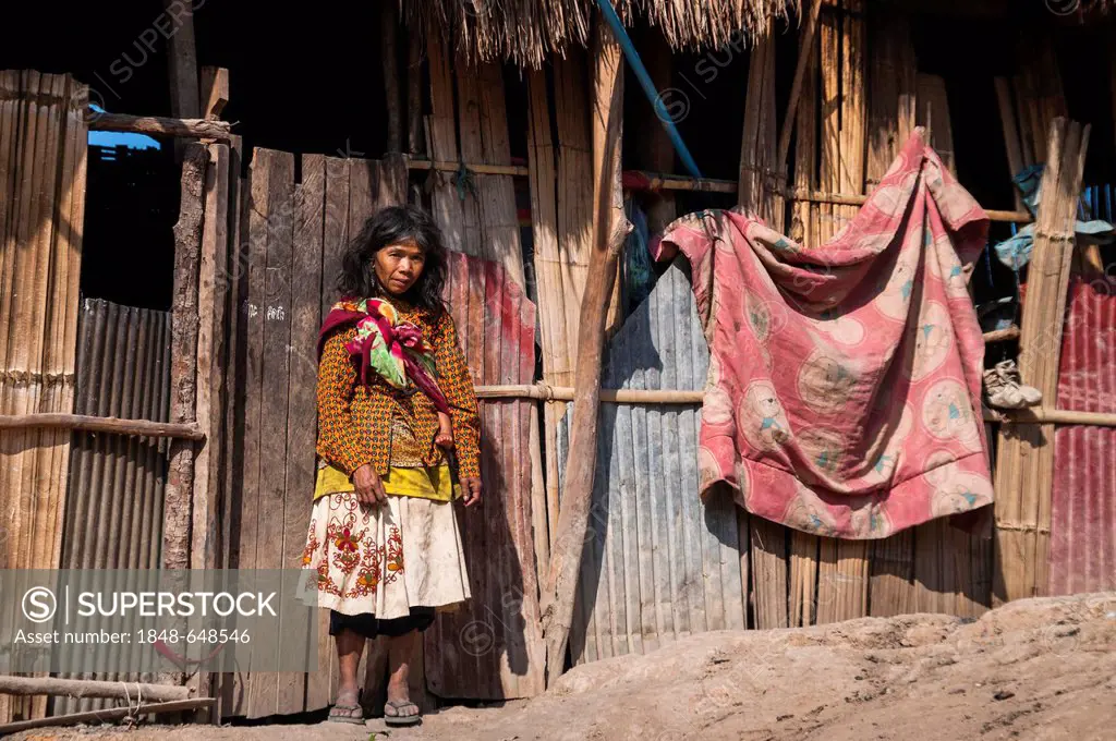 Woman dressed with modern clothing with child from the Mlabri, Mrabri, Yumbri, Ma Ku or Spirits of the Yellow Leaves hill tribe, ethnic minority, noma...