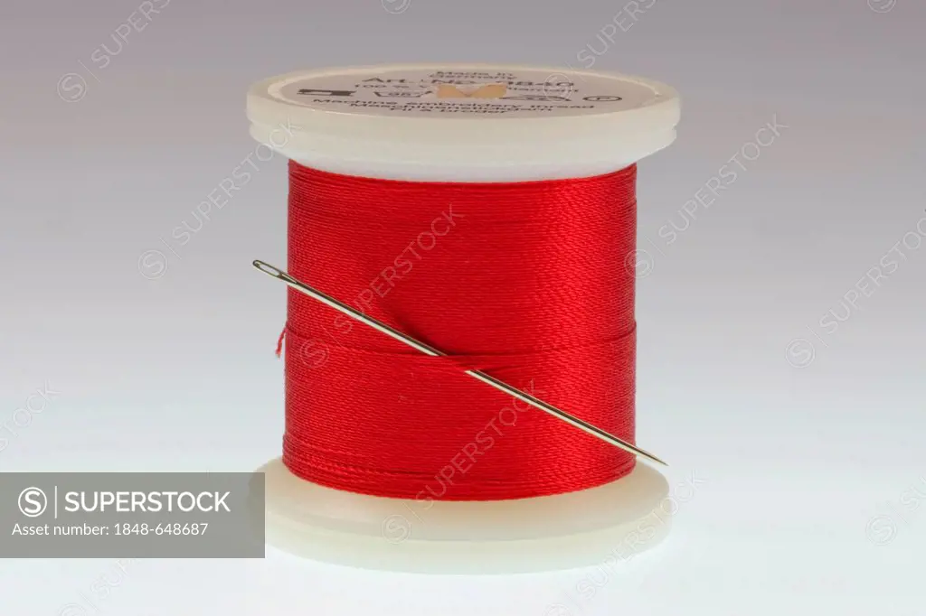 Red thread and a needle