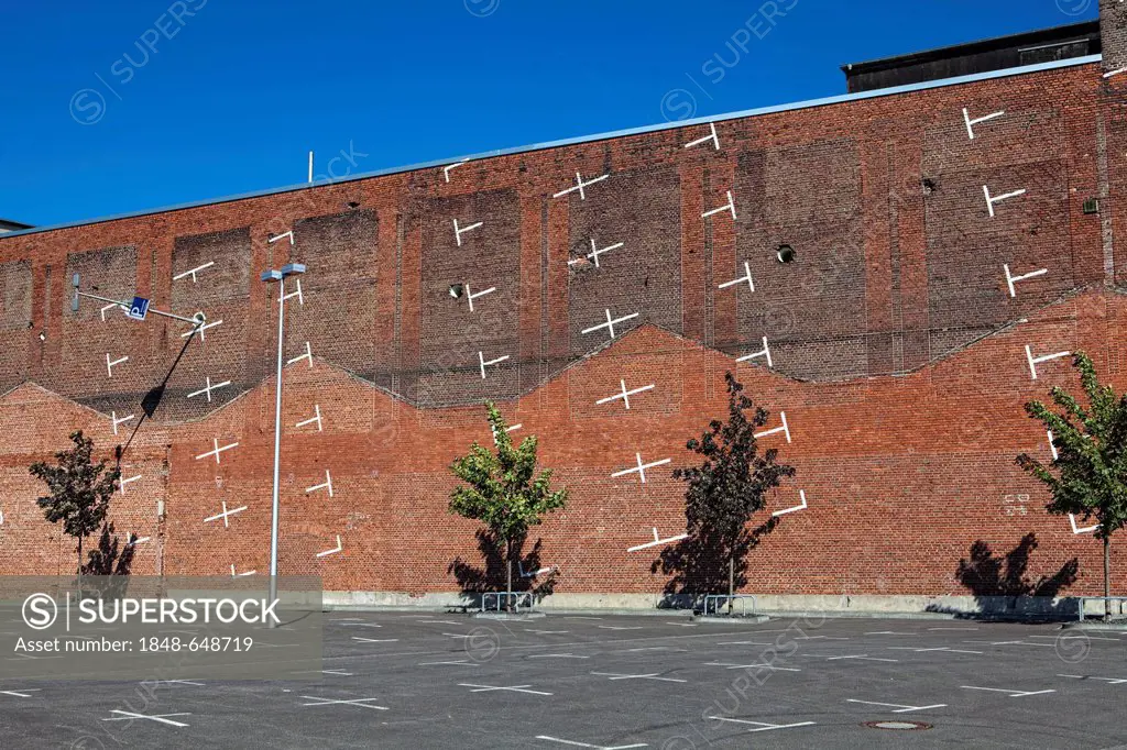 Vertical parking site, art work created by the osa Project, office for subversive architecture, on the wall of a factory building, Cologne Trade Fair,...