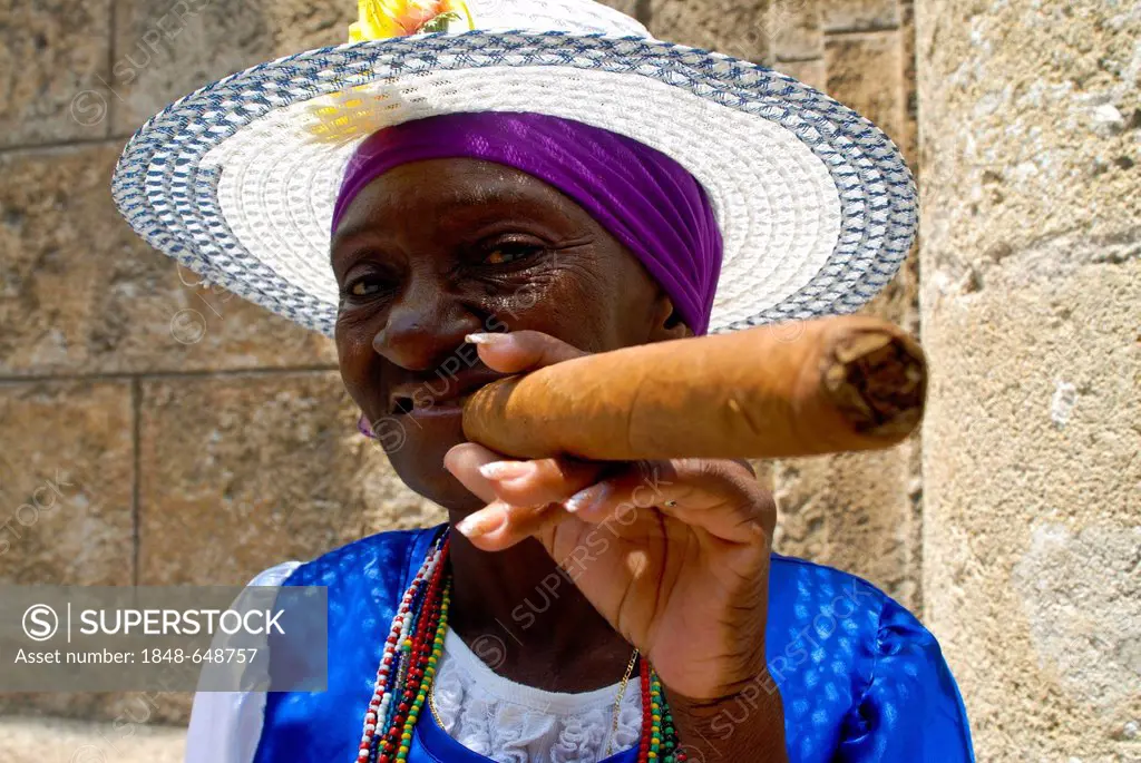Woman smoking a cigar, Havana, Cuba, Caribbean