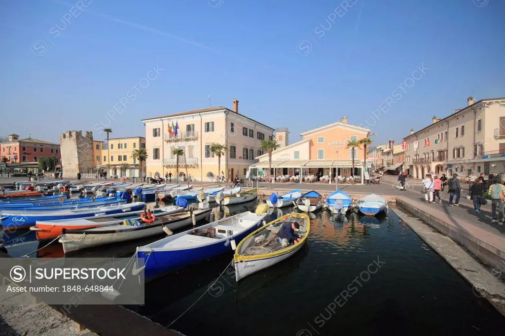 Fishing boats in the harbour and the lakeside promenade, Bardolino on Lake Garda, province of Verona, Veneto region, Italy, Europe