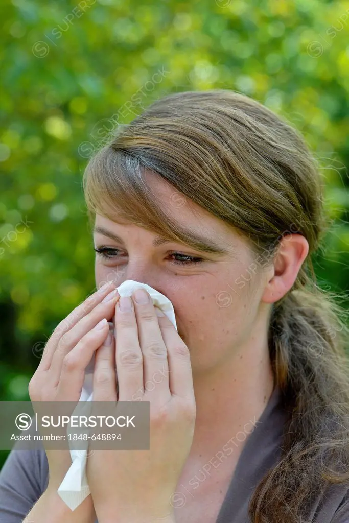 Woman blowing her nose, handkerchief, hanky