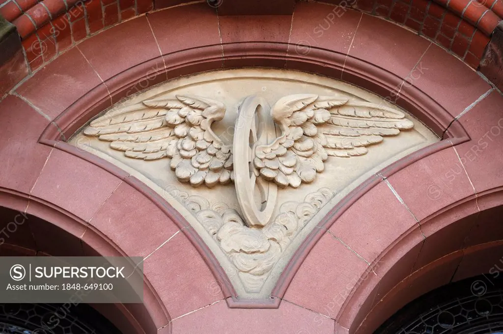 Relief with wings and a wagon wheel, a common theme in the logo of railway companies, former Reichsbahn railway building, Station 15, Schwerin, Meckle...