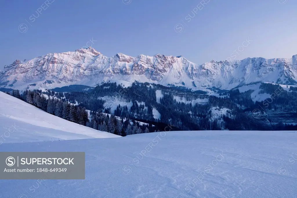 Evening mood on the wintery Hochalp mountain pasture, in the Swiss Alps, Alpstein range with Mt. Saentis, Switzerland, Europe