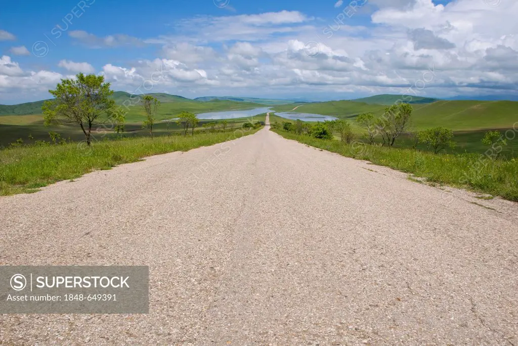 Road through the unforested green mountain landscape in Kakheti, Georgia, Caucasus