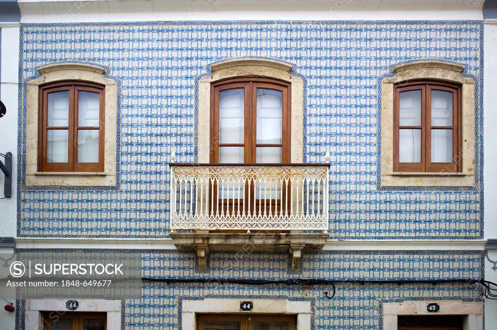 Typical, painted Azulejo ceramic tiles on a house facade, Lagos, Algarve, Portugal, Europe
