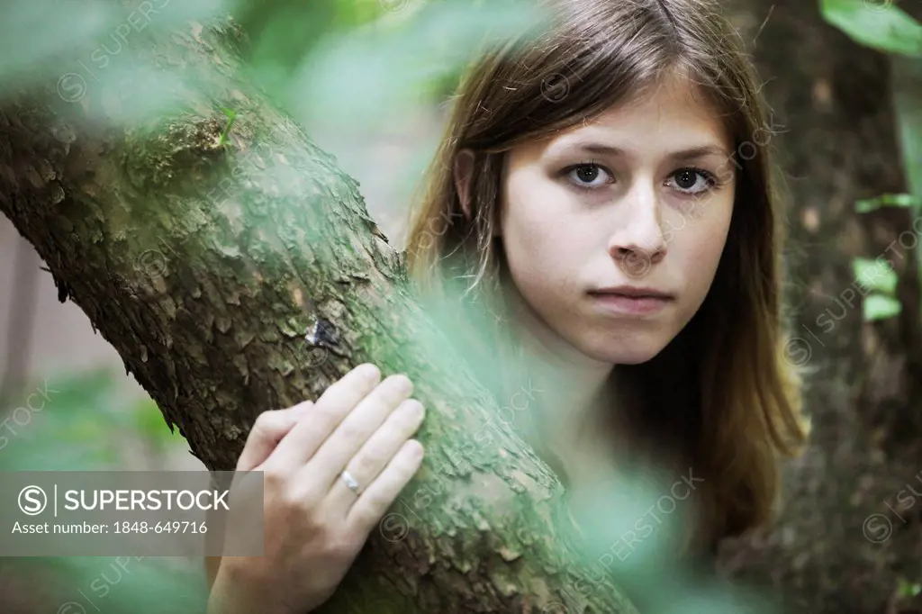 Young woman, portrait, in natural surroundings