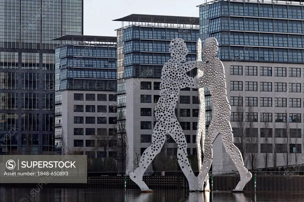 Molecule Man, monumental metal sculpture in the Spree river, Treptowers Allianz administration, Treptow district, Berlin, Germany, Europe
