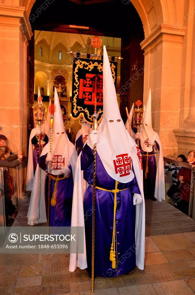 Penitents, Nazarenos, in their typical hooded robes during the festivities of Semana Santa, Holy Week, procession, Good Friday, Alicante, Costa Blanca...