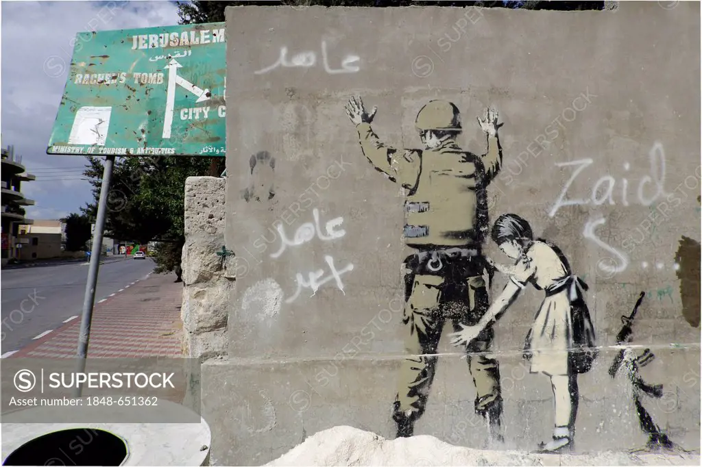 Wall with a graffito by Banksy, Palestinian side, between Bethlehem, West Bank and Jerusalem, Israel, Middle East