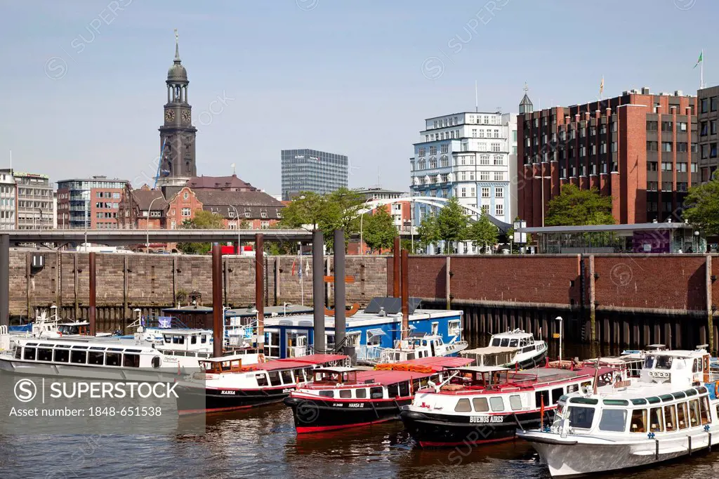 Boats in the harbor and the steeple of St. Michaelis Church, also known as Michel, Free and Hanseatic City of Hamburg, Germany, Europe