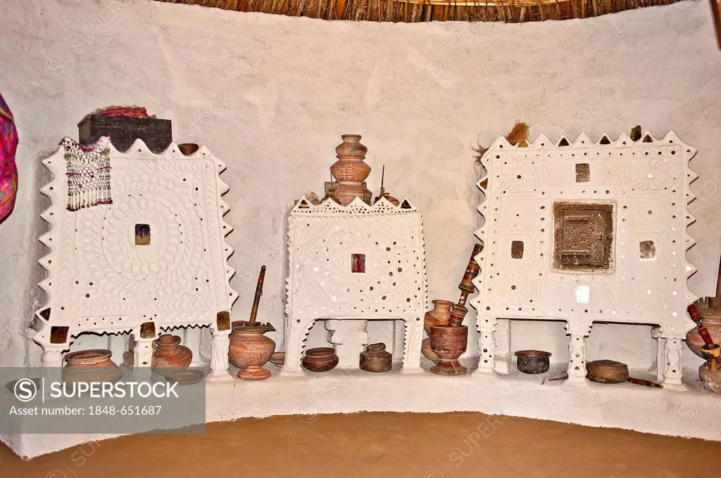 Interior view of a traditional residential home with storage cabinets and kitchen utensils, Thar Desert, Rajasthan, India, Asia