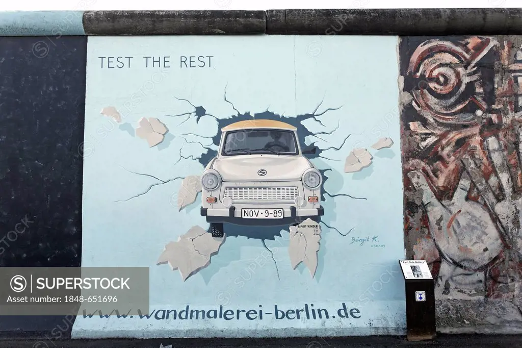 Trabant or Trabi breaking through the Berlin Wall, painting by Birgit Kinder, East Side Gallery, Friedrichshain district, Berlin, Germany, Europe