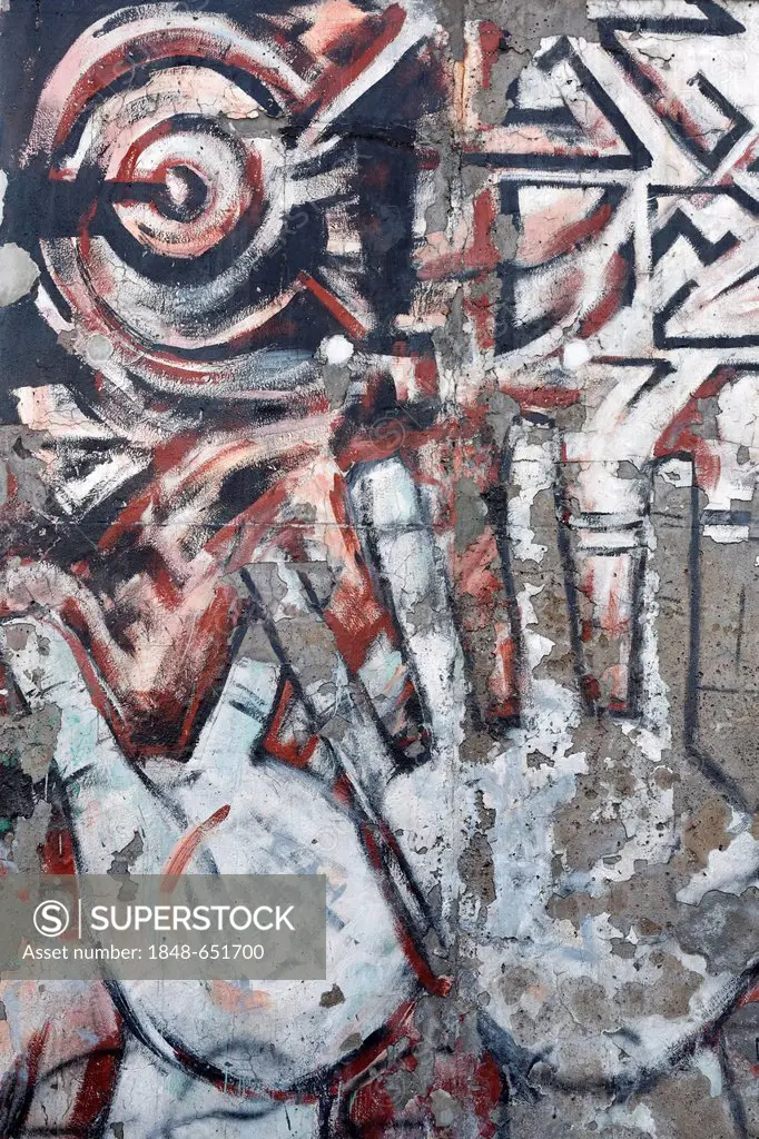 Weathered, unrenovated painting with rejecting hands on the remants of the Berlin Wall, East Side Gallery, Friedrichshain district, Berlin, Germany, E...
