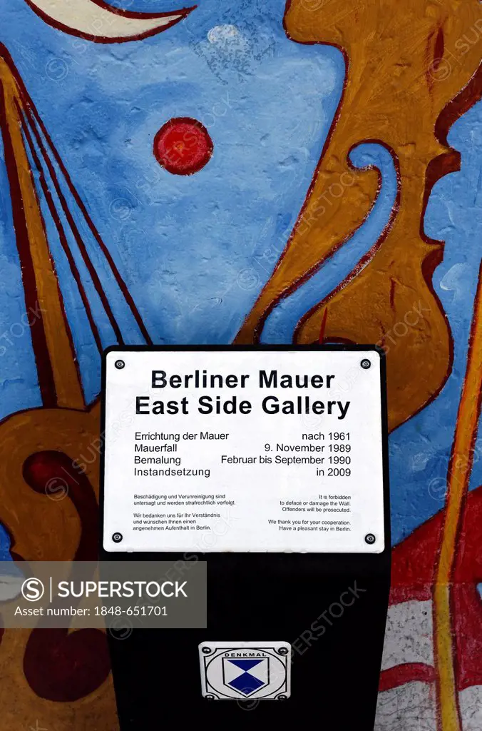 Listed building sign in front of the East Side Gallery, remants of the Berlin Wall, Friedrichshain district, Berlin, Germany, Europe