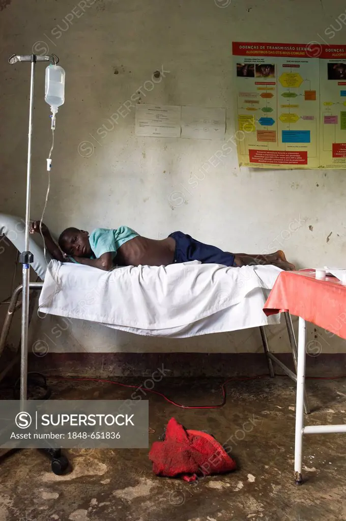 Patient with an intravenous drip tubing attached in poorly equipped clinic, Quelimane Mozambique, Africa