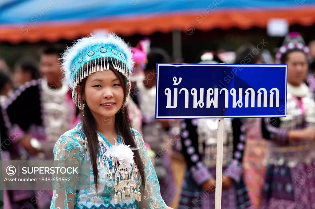 Young Hmong woman, traditionally dressed, take part in a new year festival parade at Hung Saew village, Chiang Mai, Thailand, Asia