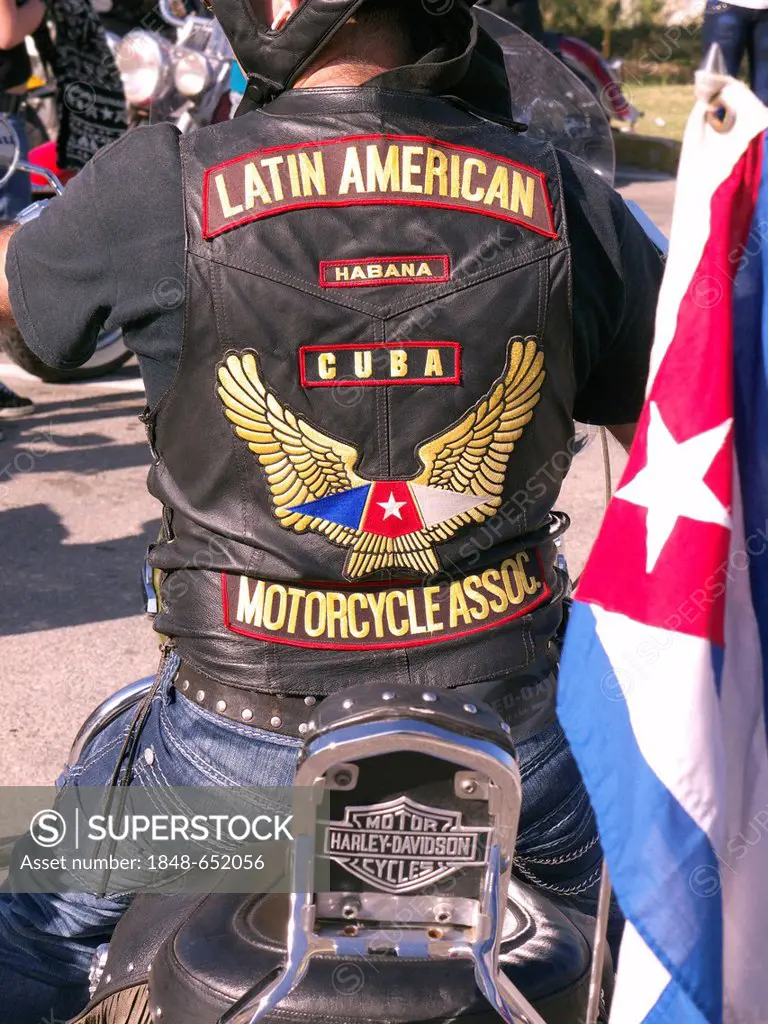 Cuban motorcyclist, a member of the Latin American Motorcycle Association, on his motorcycle with a Cuban flag, Pinar Del Rio, Cuba, Latin America