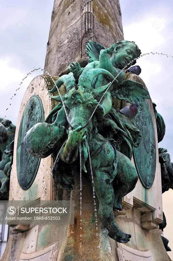 Angel figure and a billy-goat, detail view of Luitpoltbrunnen fountain, built in 1898, market square, Kulmbach, Upper Franconia, Bavaria, Germany, Eur...