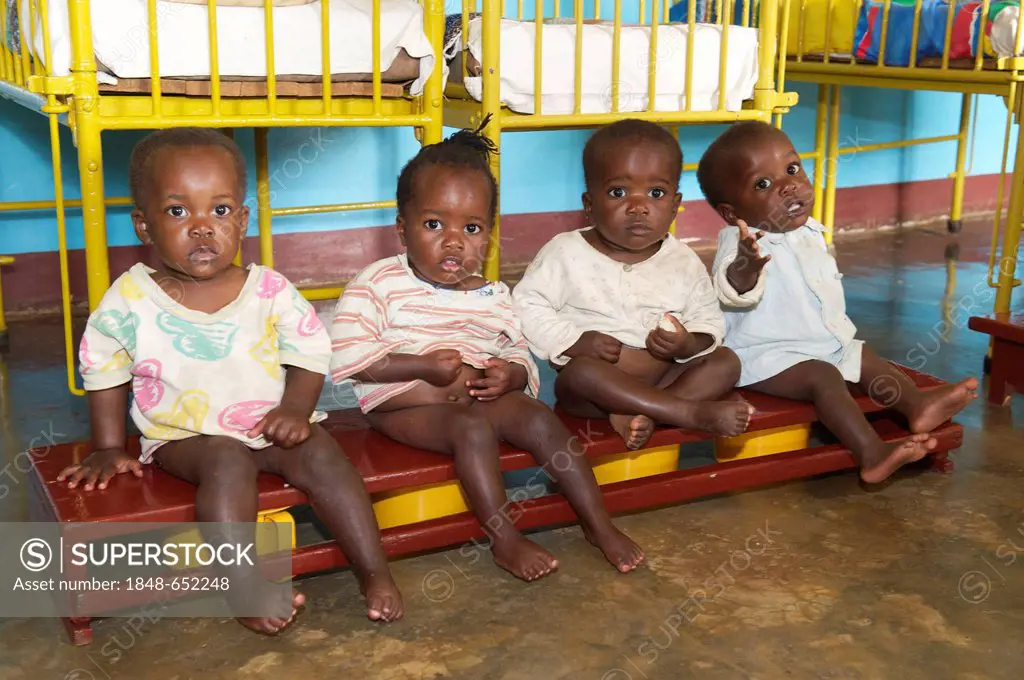 Small children on the potty in an orphanage near Bukoba, Tanzania, Africa