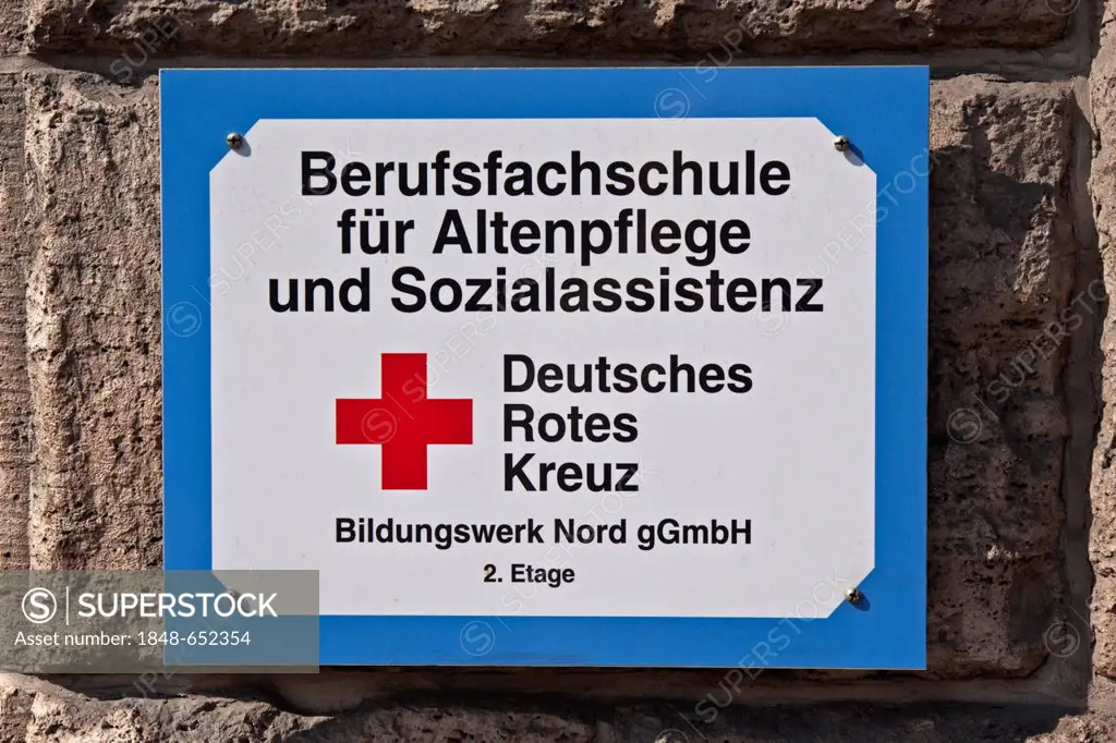 Sign on a building, Berufsfachschule fuer Altenpflege und Sozialassistenz, Deutsches Rotes Kreuz, German for Vocational School for Nursing Care and So...